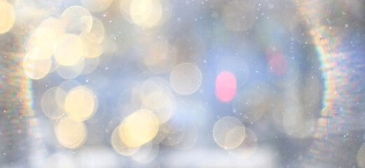 Winter abstract background with falling snow and a frame of light, sun glare, festive backdrop
