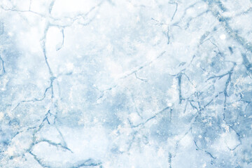 Snowy winter background in the park, blurred abstract seasonal backdrop, snowflake texture, light landscape background