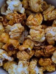 sweet caramel popcorn in a cup, close-up