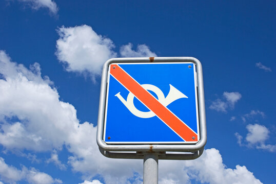 no honking allowed sign against blue sky