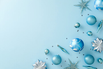 Christmas corner border with blue baubles and silver stars on light blue background