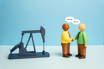 Businessmen negotiate oil production and energy resource sales. Purchase and sale of mineral...
