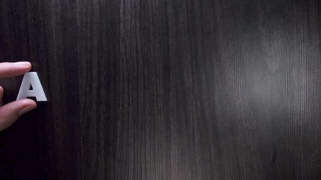 the word arthritis written on a dark background with white block letters or capital letters