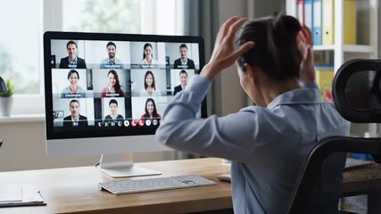 Woman participating in a video conference call from her home office. - Powered by Adobe