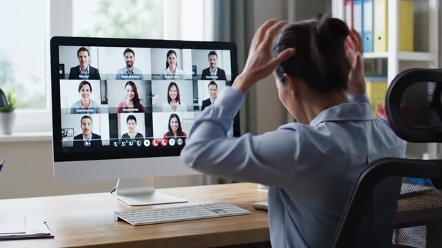 Woman participating in a video conference call from her home office.