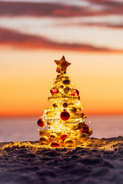 Pretty little decorated Christmas Tree on the beach