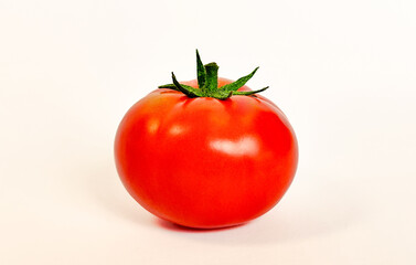 Red round tomato on a white background. Isolate