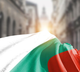 Bulgaria flag fluttering on blur street with building. Bulgaria national flag for independence day.