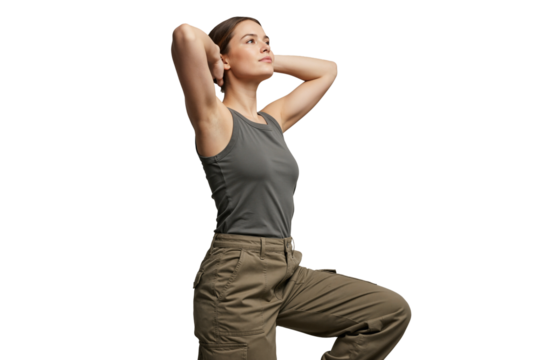 Isolated young woman in outdoor clothing posing with hands behind head