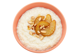 Isolated Creamy rice pudding topped with sliced pears and almonds in a pink ceramic bowl