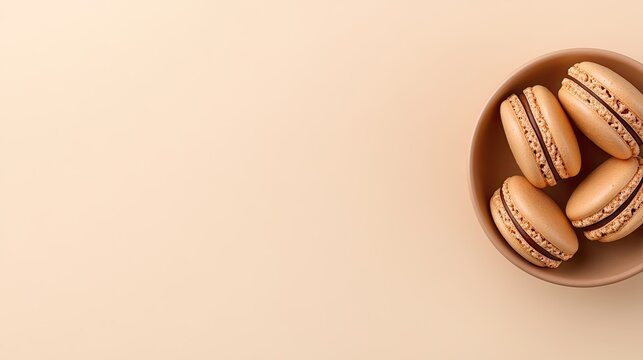 Delicate chocolate macarons fill a minimalist bowl, showcasing their smooth texture and rich color against a soft background, ideal for dessert lovers and special events - Powered by Adobe