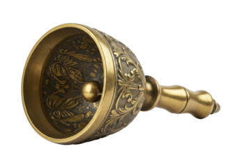 Isolated antique bronze handbell with floral pattern and handle, lying on its side, ready to use