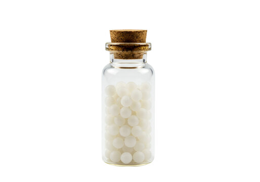 Isolated glass bottle with cork stopper filled with white homeopathic globules or pellets