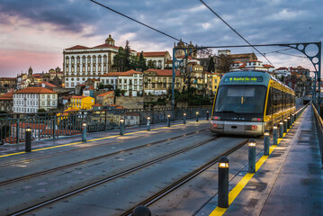 Light rail train on a Dom Luis I Bridge between Porto and Vila Nova, Portugal