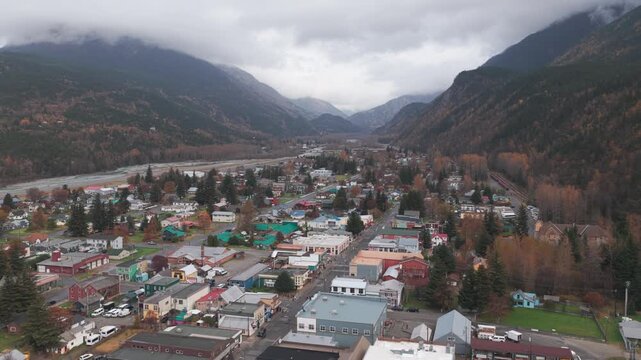 Wide aerial shot flying over historic downtown Skagway, Alaska in the fall. 4K