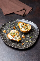 Baked pear with blue cheese, honey, and nuts. Healthy eating. Vegetarian food.