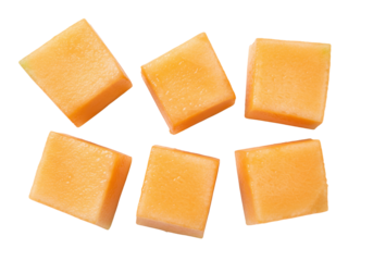 Isolated cubes of cantaloupe, cut and ready to eat, refreshing orange melon pieces