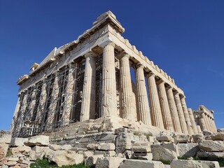 Exterior view of the Parthenon Temple, located atop of the Acropolis Hill in Athens, Greece, dedicated to the goddess Athena and build in 5th century BC to honor the Greek victory over the Persians.