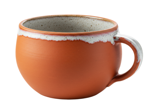 Isolated terracotta mug with white drip glaze edge, kitchenware for cozy drink break