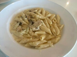 Dining serve of Penne with cream cheese in white ceramic plate, Pasta Penne 