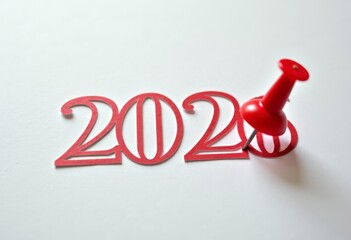 Red 2026 numbers with pushpin on white background, glossy plastic digits casting soft shadow, holiday banner concept, symbolic marking of year transition for festive planning and commercial promotion