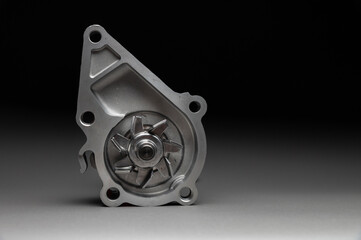 Obraz premium New spare part on a gradient gray background7 Internal combustion engine cooling system pump