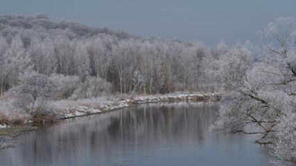 FROSTY WINTER - Snow along the river banks and morning rime on the trees 

