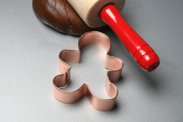 Making gingerbread cookies with copper cookie cutter.