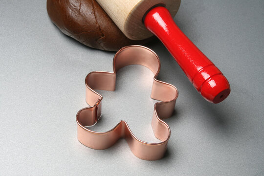 Making gingerbread cookies with copper cookie cutter.