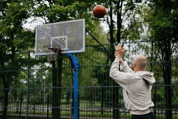 Outdoor Basketball Player Shooting a Jump Shot