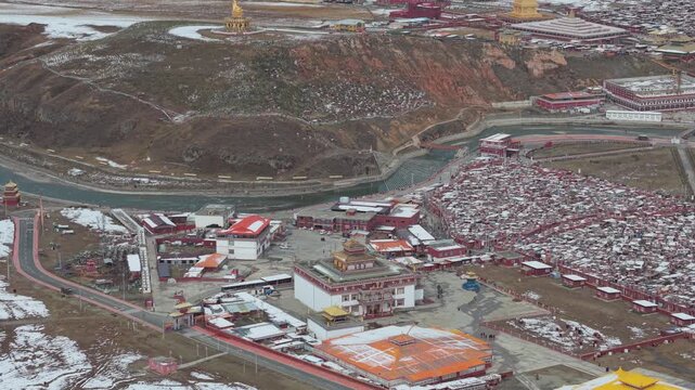 Aerial Pan Over Yaqing Monastery and Tibetan Buddhist Settlement in Winter