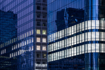 Architecture skyscraper facade reflection finance business corporate modern glass building paris shown in deep blue tones enhancing premium financial concepts
