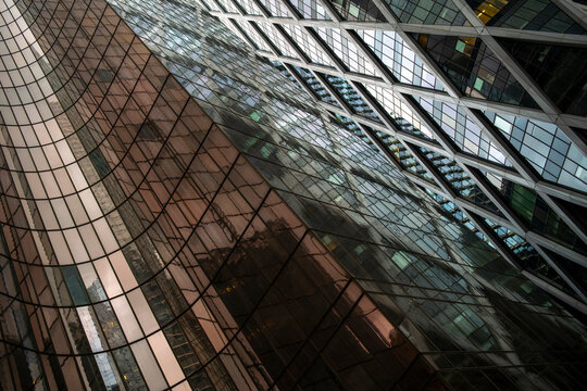 Architecture skyscraper facade reflection finance business corporate modern glass building paris presented with dramatic angles enhancing a strong financial visual tone