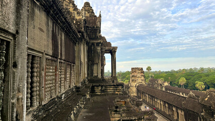 Fototapeta premium Angkor Wat: History Carved in Stone, Embraced by Nature