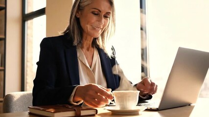 Smiling Businesswoman Working on Laptop in Bright Office, 4K Cinematic Close Up - Powered by Adobe