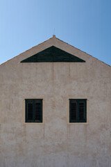 Obraz premium Minimalist Mediterranean architecture in Croatia. A beige stucco wall background. Ideal for designing with copy space. Famous UNESCO destination.