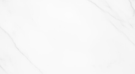 Close-up of a white marble surface with subtle veining patterns.