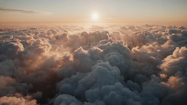 Golden Hour Above the Clouds: Aerial View of a Sea of Fluffy Clouds at Sunset