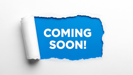coming soon paper tear. coming soon text message revealed through ripped white paper on a bright blue background announcement concept