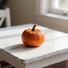 Single Small Orange Miniature Pumpkin Resting on a Weathered White Rustic Wooden Table by a Sunlit Window