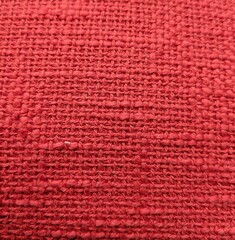 Fototapeta premium Fondo con textura de tejido áspero. Vista de cerca de tejido de arpillera de color rojo