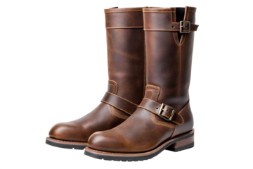 A pair of classic brown leather engineer boots with adjustable buckle straps, isolated on a clean white background
