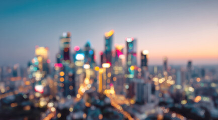 Urban skyline at dusk showing blurred city lights reflecting on skyscrapers, creating a colorful bokeh background representing modern architecture and urban life
