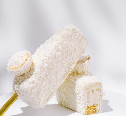 Delicious coconut desserts stacked on a clean surface