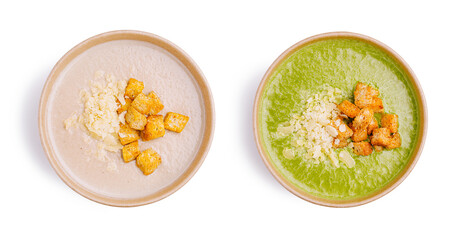 Two bowls of creamy soup with croutons and cheese on a white background