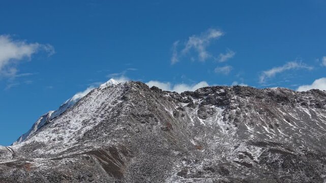 Drone Reveal Shot of Yala Snow Mountain in Winter