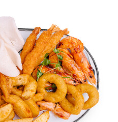 Delicious seafood platter served with crispy sides and fresh garnishes