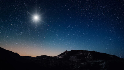 night Christmas panorama with a star in the sky