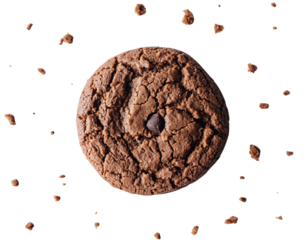 Delicious chocolate chip cookie floating against a dark background with crumbs