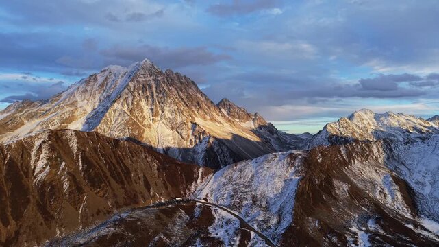 Drone Reveal Shot of Yala Snow Mountain sunset in Winter